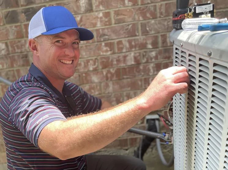 SCP Refrigeration Owner installing AC condenser